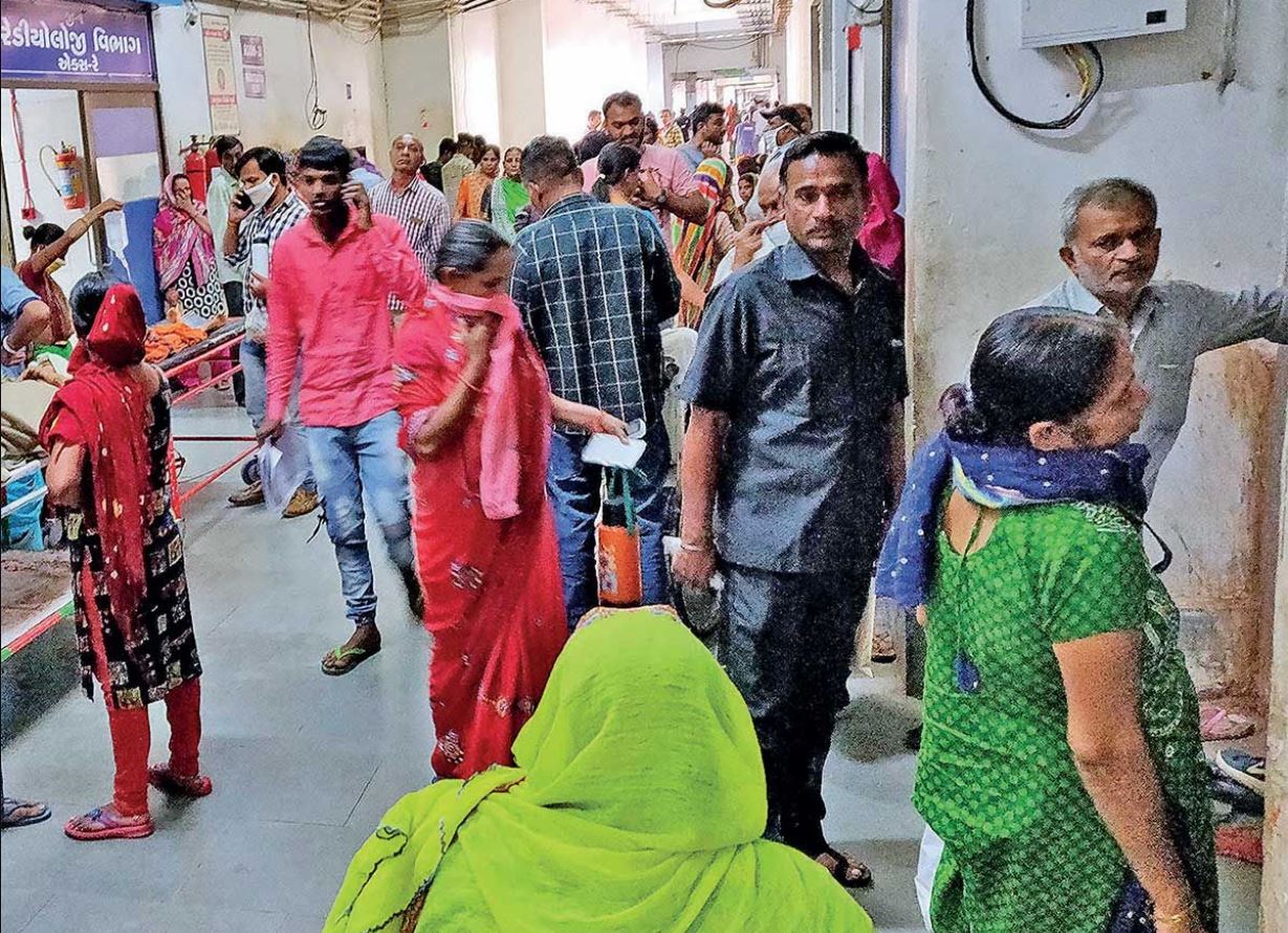 Patients waiting in long queues at Civil Hospital, Asarwa, highlighting pressure | Soche India